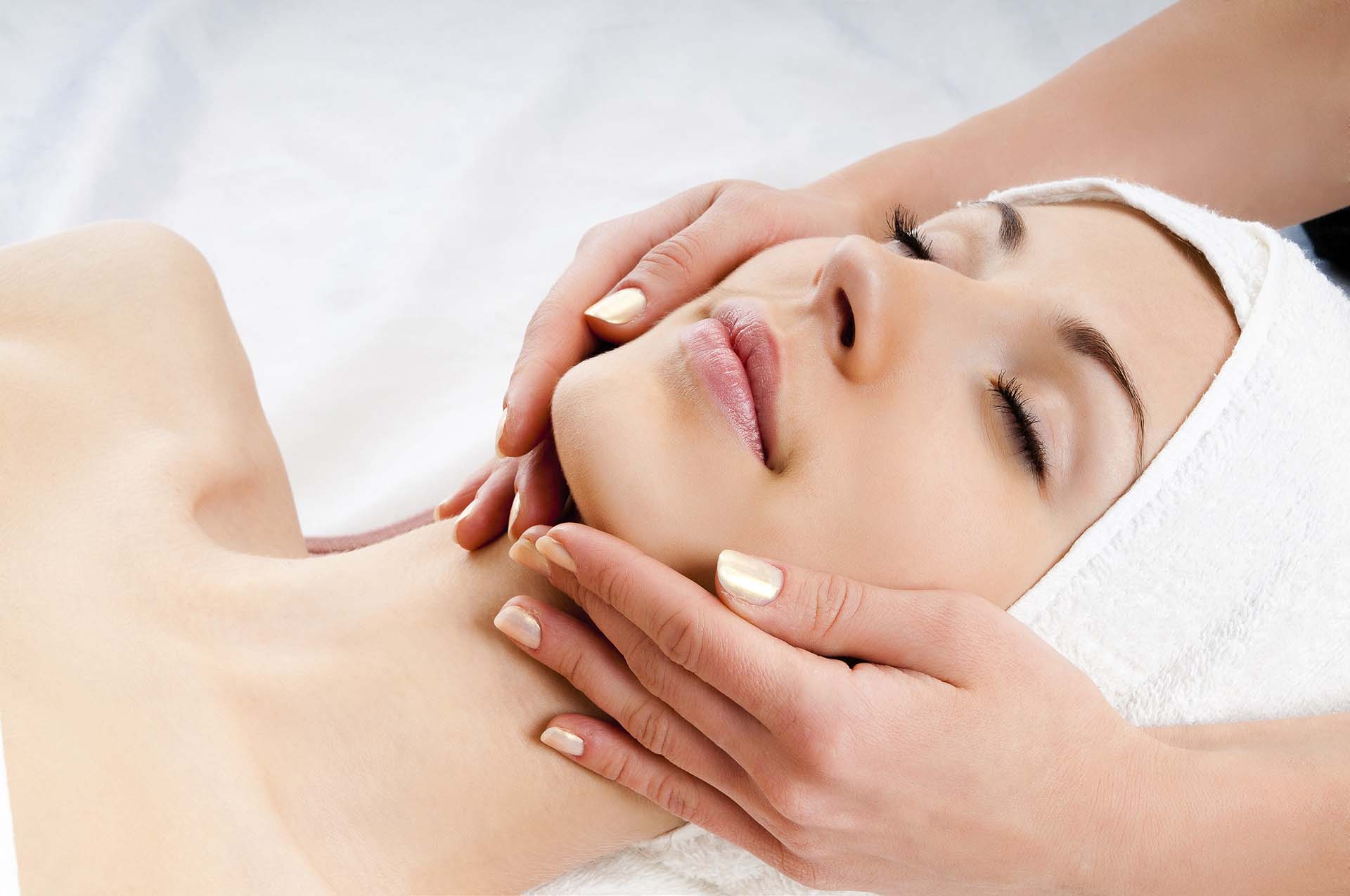Woman receiving a relaxing facial treatment